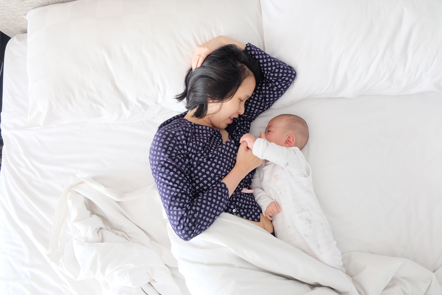 newborn-baby-laying-in-the-bed